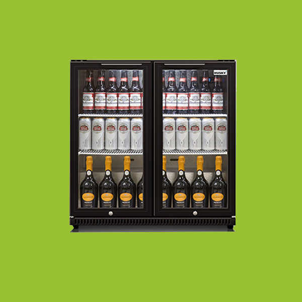 A double-door refrigerator, labeled "Husky," displays beer bottles on the top shelf, beer cans on the middle shelf, and bottles of wine on the bottom shelf, against a green background.