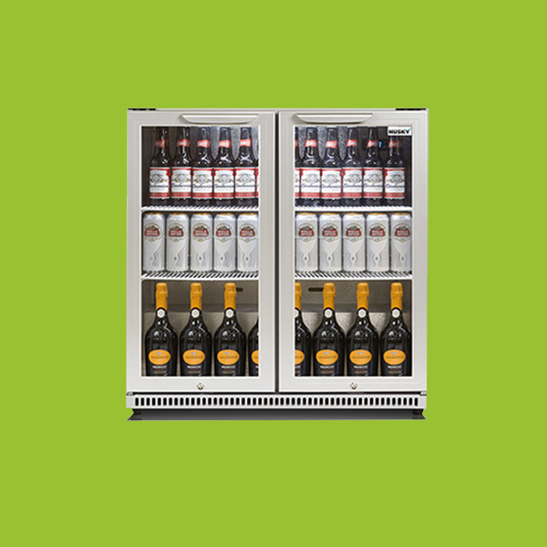 A double-door beverage fridge holds bottles of beer and wine, organized on three shelves. The surrounding background is solid green.