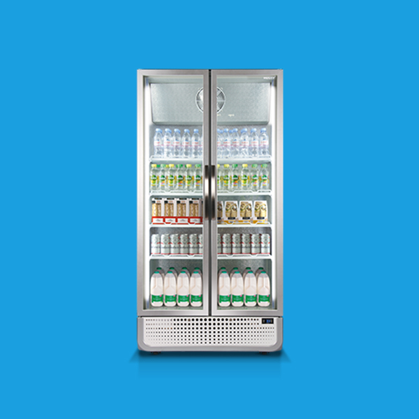 A two-door stainless steel refrigerator displaying neatly arranged beverages, including bottled water, canned drinks, and milk, set against a plain blue background.