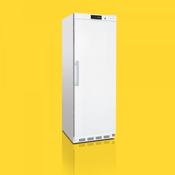A tall, white, closed refrigerator stands upright on a reflective surface, set against a vibrant yellow background.