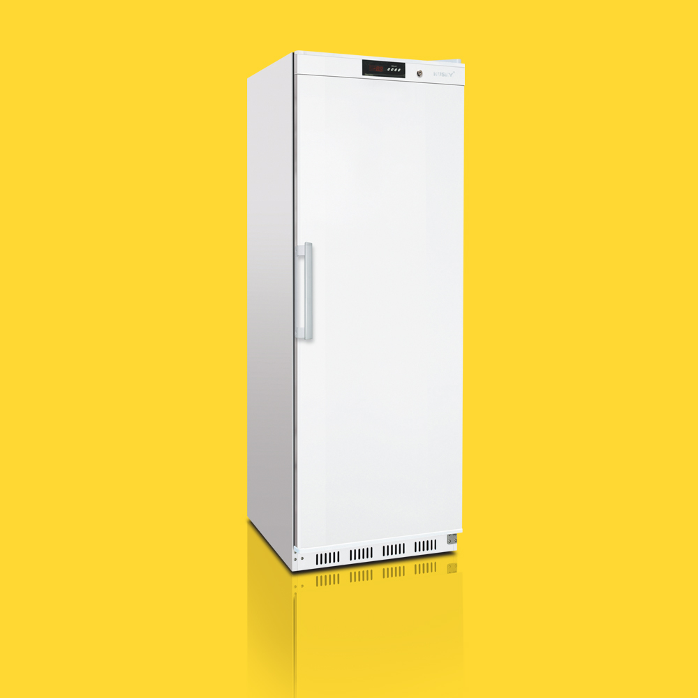 A tall, white, closed refrigerator stands upright on a reflective surface, set against a vibrant yellow background.