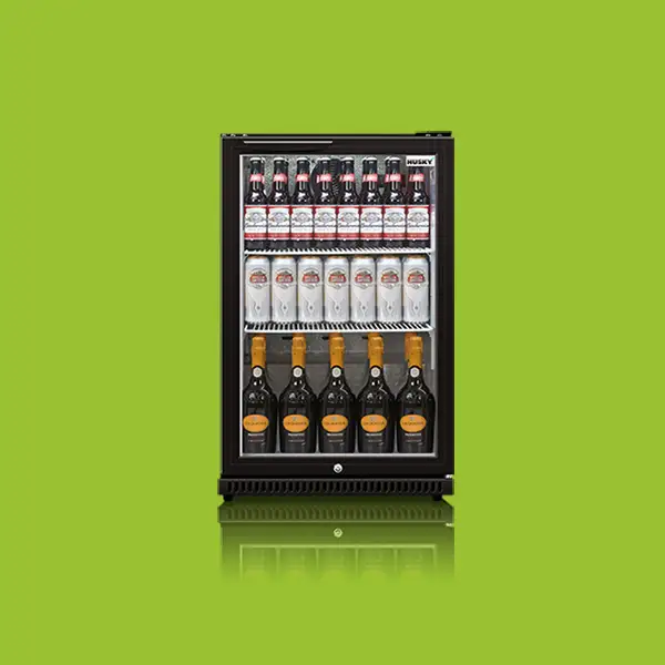 A black mini refrigerator (object) displays three rows of beverage bottles (action) against a green background (context). The top row has small bottles, the middle row has medium bottles, and the bottom row holds larger bottles.