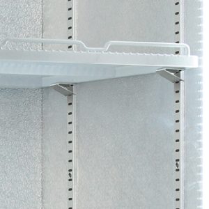 A white metal shelf is mounted on a wall, held up by metal brackets, and surrounded by aluminum paneling with vertical perforations.