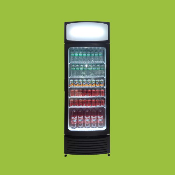 Refrigerator stocked with bottled drinks including Sprite, Fanta, Coca-Cola, and Vimto, standing against a bright green background.