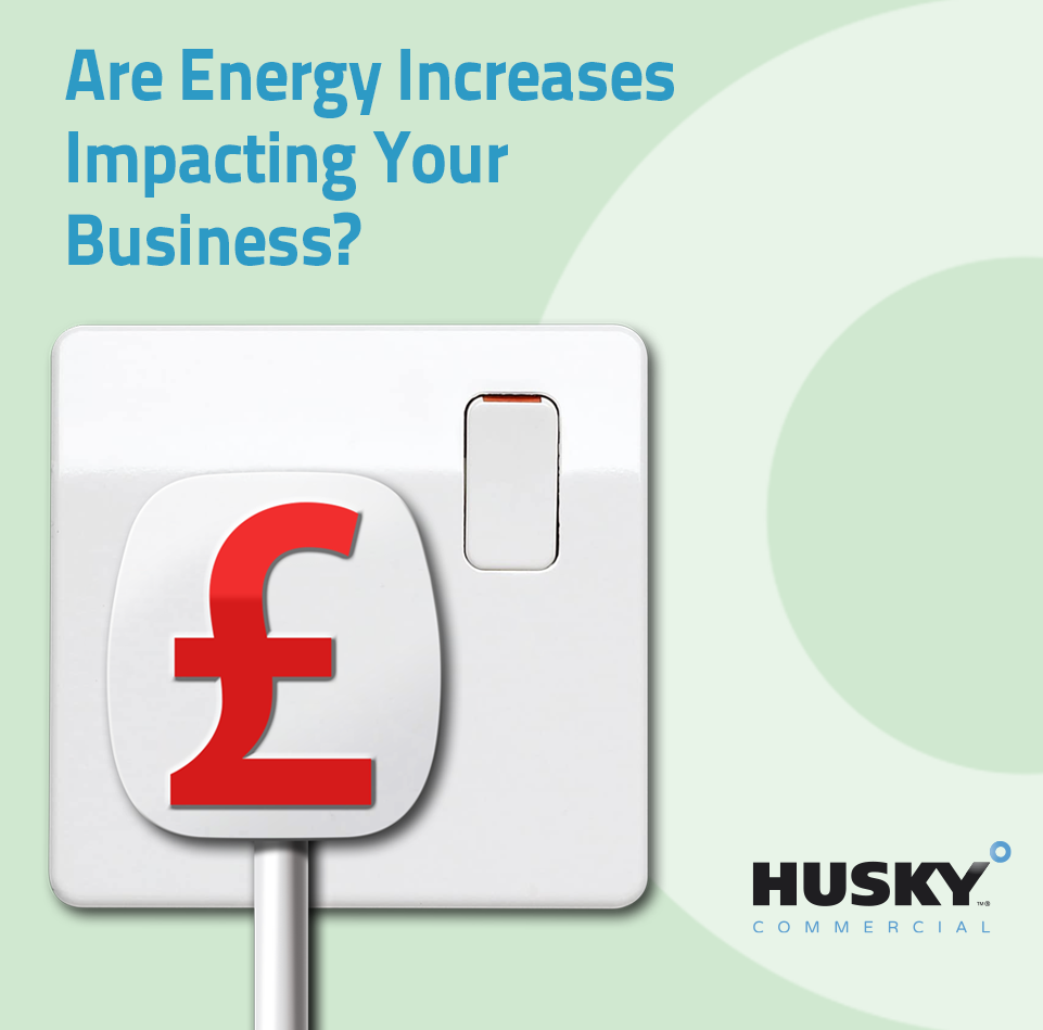 White light switch with a red currency symbol resembling the British pound (£), partially seen against a light green background with circular designs.