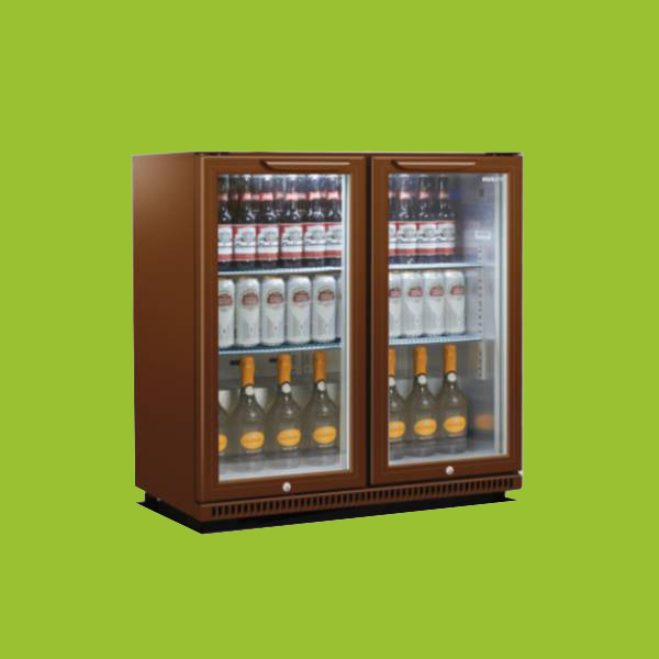 A double-door glass-front refrigerator contains bottles of various drinks, organized in rows, set against a plain green background.