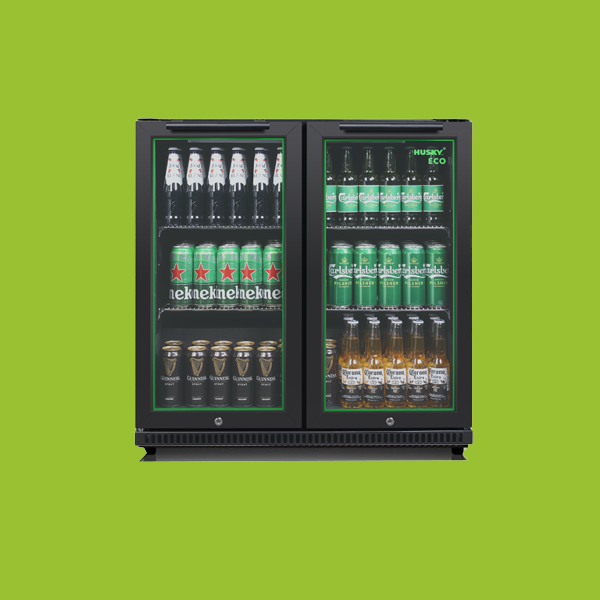 A double-door refrigerator, labeled "Husky ECO", displays beer bottles on the top shelf, beer cans on the middle shelf, and bottles of beer and cans of beer on the bottom shelf, against a green background.